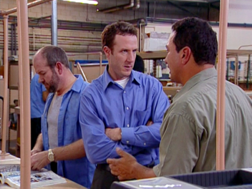Team members' intense discussion in the warehouse